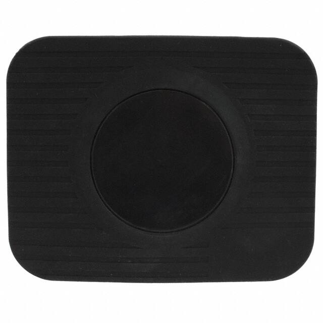 A rectangular black rubber pad with rounded corners and a circular raised section in the center, the **Ultra-Low Profile DashMat by PIVOT**. The pad has a ribbed texture radiating outwards from the central circle. The background is white, enhancing the contrast of the black pad.