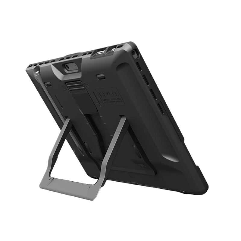 A black Surface Pro X encased in a protective PIVOT cover is shown from the back, with its kickstand extended. The kickstand allows the tablet to stand upright. The protective case has a rugged design, featuring a textured surface and reinforced corners.