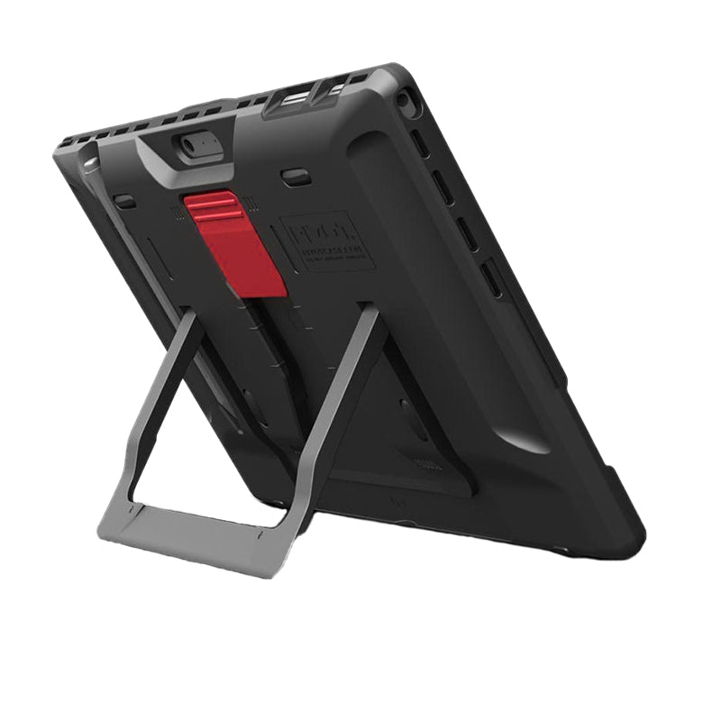 A rugged black tablet, reminiscent of the PIVOT Surface Pro X, is shown from the back, featuring a built-in kickstand in an open position. The tablet has a red accent near the camera and appears to have a durable, protective case designed for heavy use.