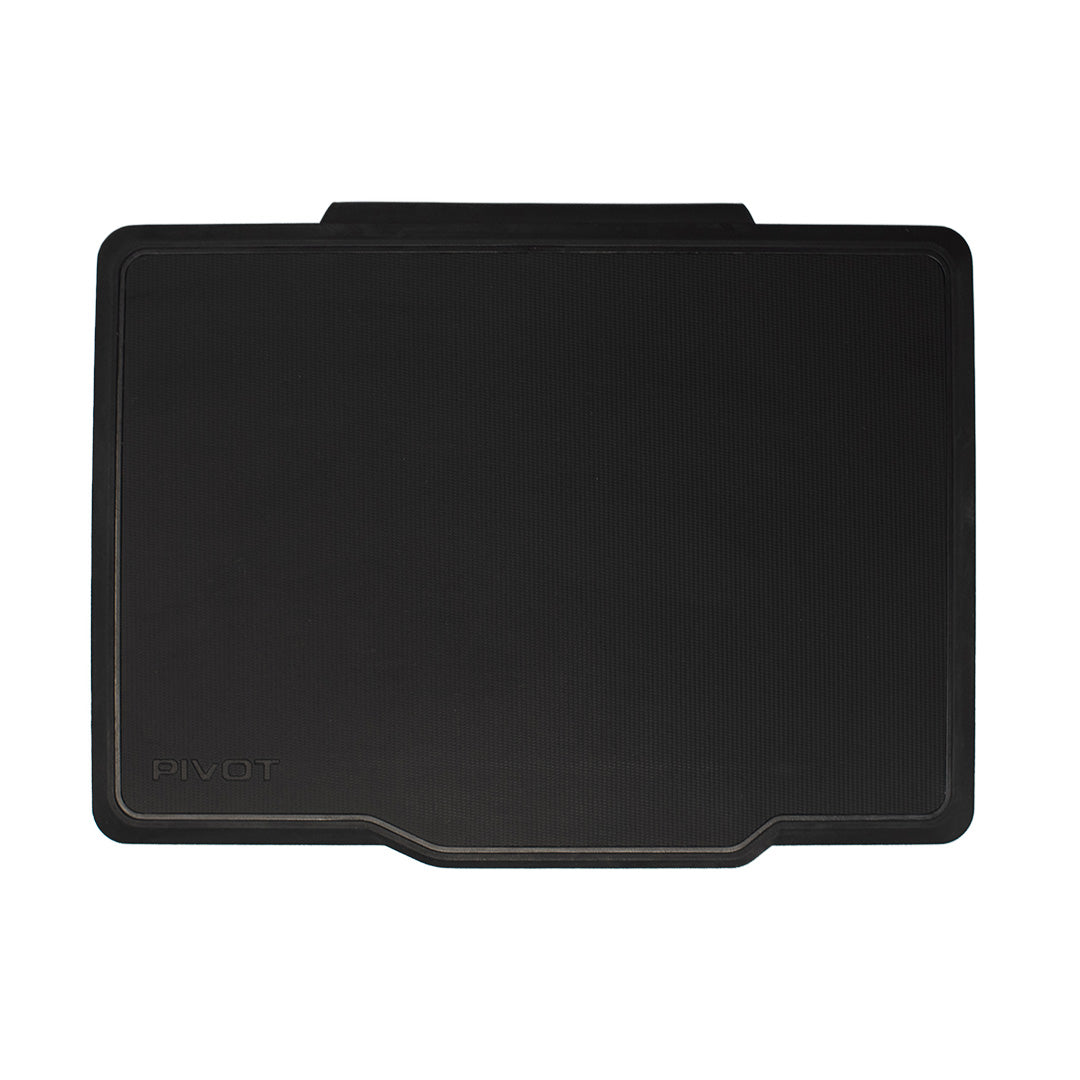 A black rectangular Pro 105 Folio Cover with a small raised section at the top, designed to provide comfort and support while standing. The brand name "PIVOT" is embossed on the lower left corner of the cover.