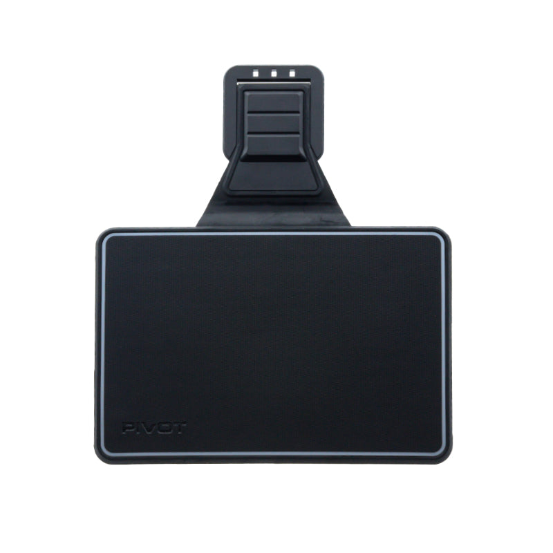 The image shows a rectangular black device with the brand name "PIVOT" visible in the bottom left corner. It has a protruding attachment on the top with a clamping mechanism. The device appears to be a mount or holder for electronics, possibly designed as a MINI 4 Folio Cover.